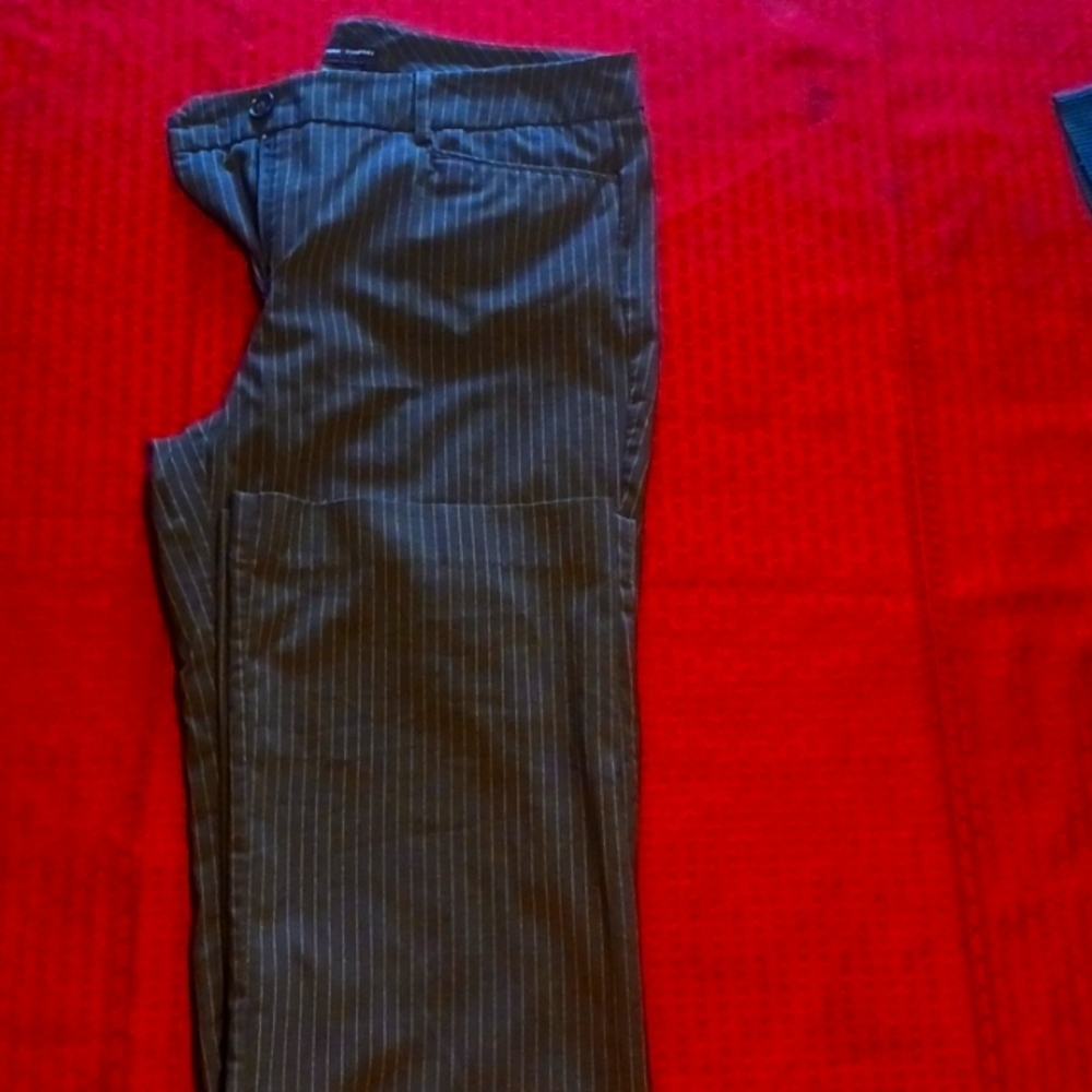 New York & Company size 8 tall black and grey vertical pin stripped slacks.